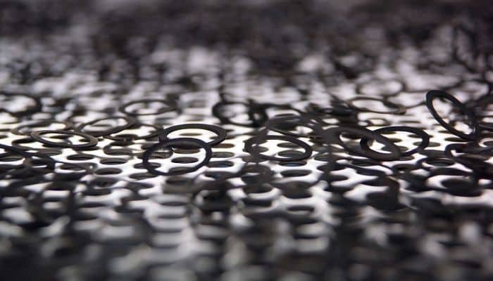 Hundreds of aerosol gasket seals bouncing along the production line