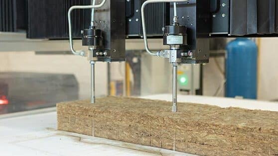 Twin water jet cutting machine in action
